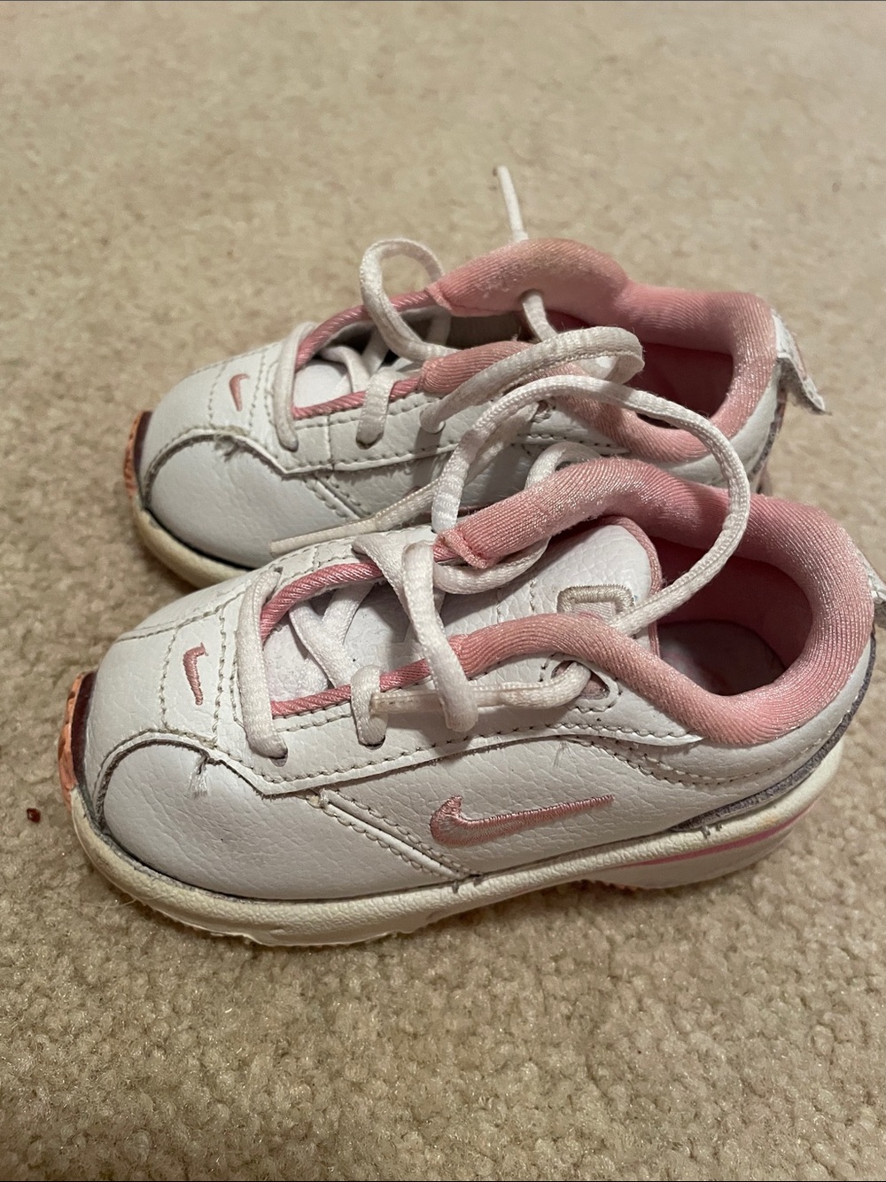 Nike size 4 White and Pink Kids Athletic Sneakers